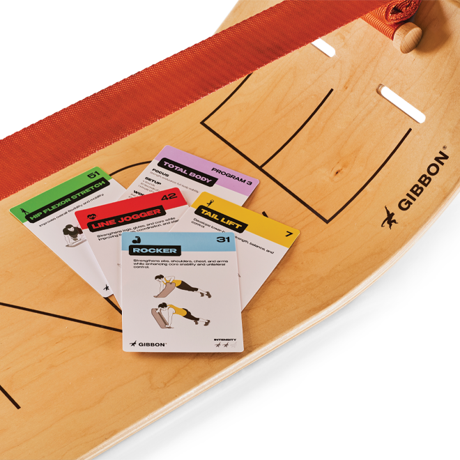 Wooden board with cards on top, featuring the GIBBON brand.