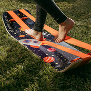 Person stepping onto an astro slackboard plus on grass